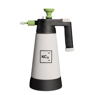 Spray bottle with KCx logo on a black background
